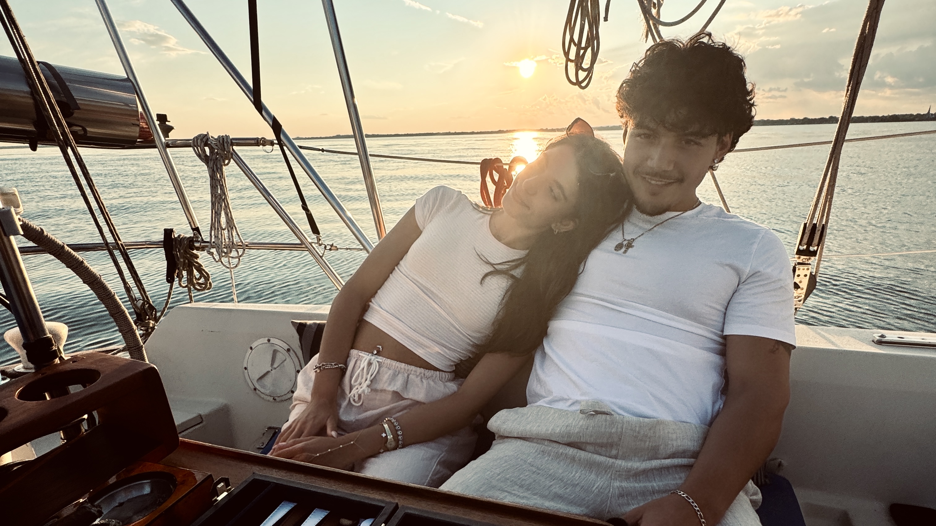 Golden hour on a sailboat sets the mood